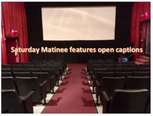 a photo of our auditorium saying saturday matinee features open captions